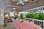 Large covered veranda with seating for 10 to enjoy meals, ceiling fans